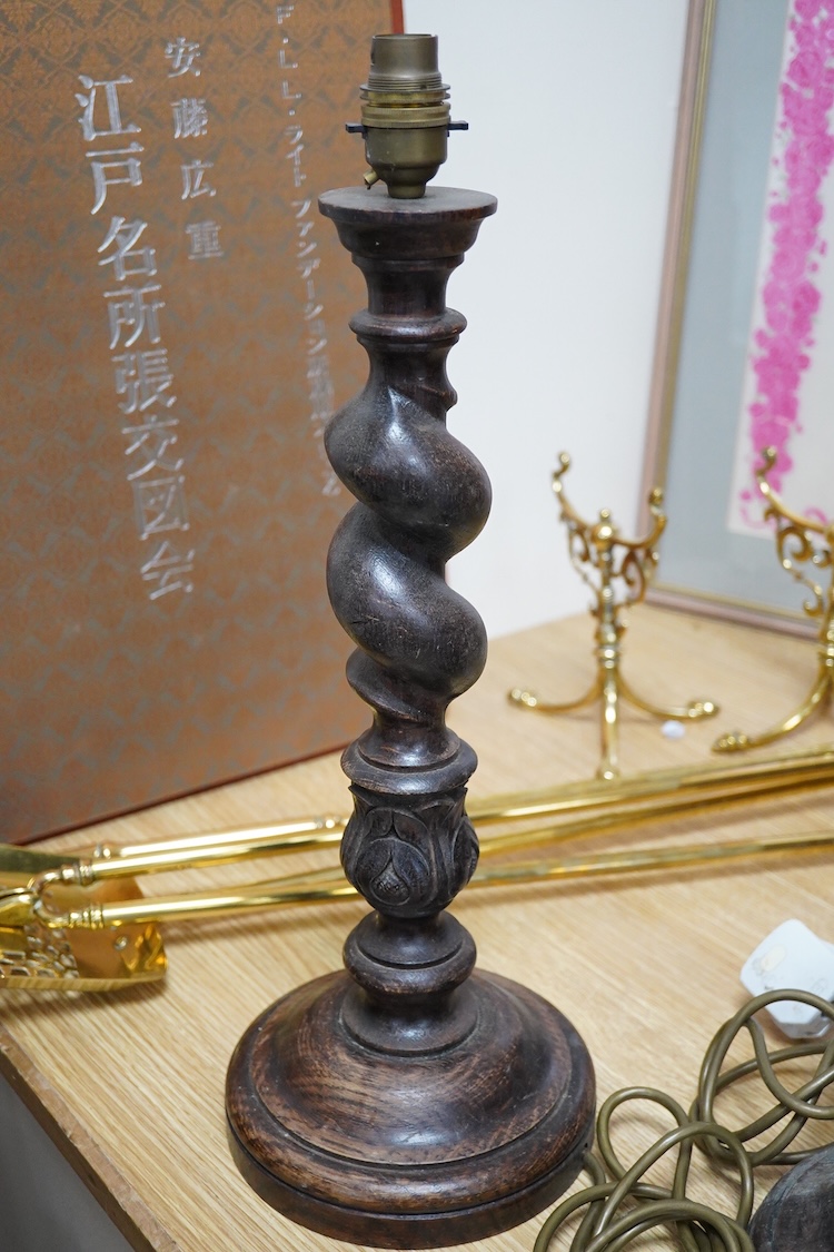 A pair of carved oak barley twist table lamps, 42cm